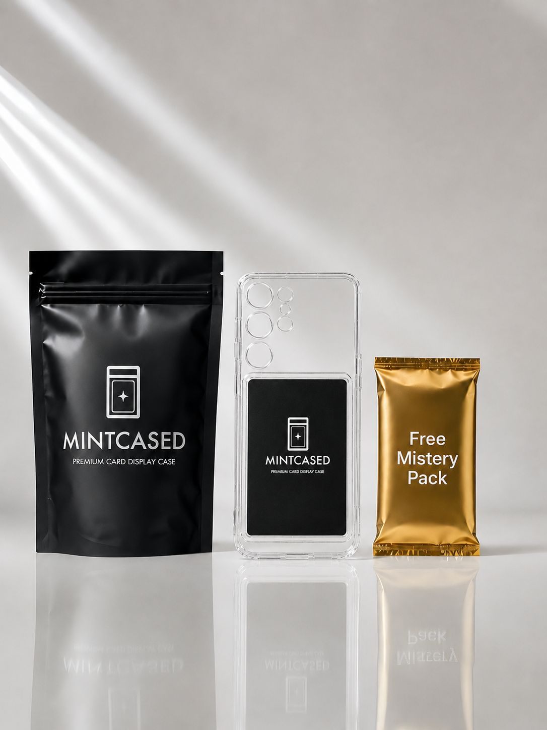 Three Mintcased packaging items on a reflective surface with a white background
